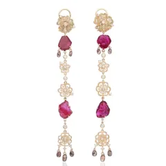 My 4-inch long 'shoulder duster' earrings, designed to be breezy and light. They are handcrafted in 18k gold with filigree flower motifs, featuring raw Mozambique rubies and drops of white and brown diamonds.