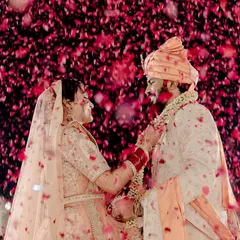A magical shot from my wedding's Jaimala ceremony, showered with rose petals. This is the kind of picture-perfect, romantic moment that I love to enhance with beautiful live music.
