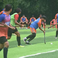 A player maneuvers the ball during a competitive practice match. Our sessions for juniors and adults are focused on developing tactical gameplay and teamwork.