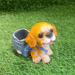 This cute dog pen holder, resembling a Cocker Spaniel, is a great way to keep your study table tidy. It's crafted with lovely detail and is a perfect gift.
