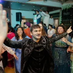 The groom owning the dance floor with his friends and family. These are the fun, energetic moments that everyone will remember.