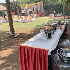 A long buffet line set up in an outdoor lawn for a haldi ceremony in Uran. I can set up my catering service in any kind of venue, indoor or outdoor.