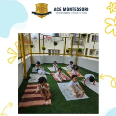 Our rooftop yoga space provides a peaceful, open-air environment for children to practice their poses. This forward bend helps with flexibility and brings a sense of calm to their bodies.