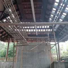 A look inside the structure during the restoration, with scaffolding in place. This view reveals the complexity of working with a traditional roof structure while ensuring its long-term stability.