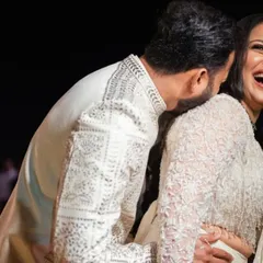 A candid moment of pure laughter and affection between the couple during their Sangeet night.