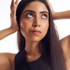 This image captures a fresh and youthful glow. The makeup is barely there, intended only to even out the skin tone and add a touch of color to the cheeks and lips for a healthy, vibrant look.