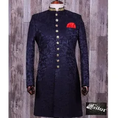 A royal blue brocade sherwani with intricate self-design and gold buttons. The embroidered collar adds a touch of luxury, making it ideal for a groom.