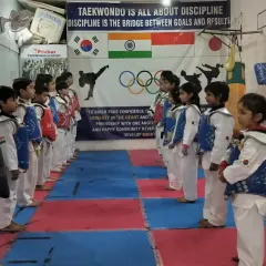 Our youngest fighters lined up and ready for sparring practice. We instill discipline and respect from the very first day.