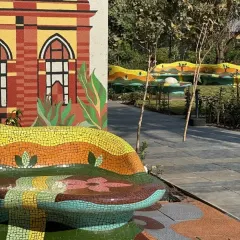 Another angle of the mosaic bench, highlighting the intricate patterns and custom-designed curves that invite interaction.