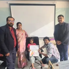 One of our talented winners receiving her prize for the coloring competition. We love celebrating the artistic achievements of our students alongside their families.