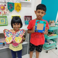 A perfect sibling activity! These two had a great time at the studio making a colorful butterfly mosaic and a personalized photo frame as a special gift for their dad.