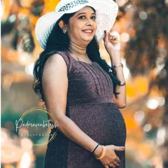 A happy and bright shot from the maternity session. The makeup is light and fresh, perfect for an outdoor photoshoot, ensuring the mommy-to-be looks and feels her best.