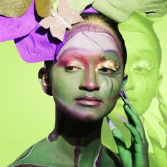 Beauty is an art form. Here, avant-garde body paint is perfectly complemented by long, sharp nails, showing how nail artistry plays a crucial role in creating a complete, high-fashion look.