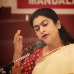 A student presenting a devotional piece during the 'Swarveni Aradhana' as part of the Mandala Puja celebrations.