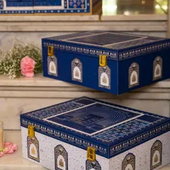 Here are two variations of the Golden Dunes trousseau boxes, one in deep indigo and the other in a contrasting white. This shows how I can customize the color palette while maintaining the collection's signature architectural and heritage motifs.