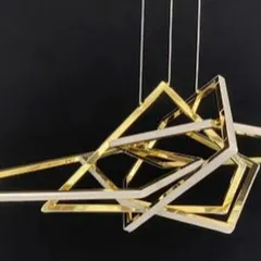 This geometric LED pendant light is a work of modern art. The interlocking, stainless steel triangular frames create a dynamic and futuristic centerpiece for any contemporary space.