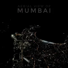 Mumbai transforms at night, and this is its electric pulse seen from above. This aerial night shot captures the iconic Queen's Necklace and the city's grid of lights. Capturing clear, detailed nightscapes requires specialized drone equipment and piloting skills to manage low-light conditions.