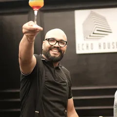 Cheers from one of our expert mixologists. We call this colorful creation the 'Rollercoaster' because it's a journey of sweet and sour flavors, just like life. We love interacting with guests and making sure everyone has a great time.