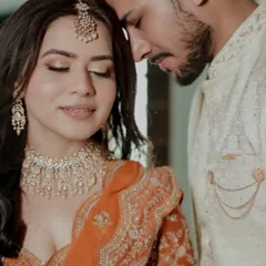 A moment of quiet connection amidst the celebration. This close-up portrait captures the serene and loving bond between the couple, a peaceful pause on their wedding day.