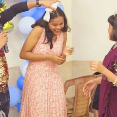 The birthday girl's reaction says it all! A moment of surprise and delight during my live pigeon magic trick.