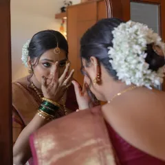 A quiet moment of reflection for the bride as she gets ready in her room for her home wedding.
