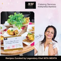 A complete, bite-sized appetizer featuring a succulent piece of paneer tikka served on a miniature Malabar parantha. This dish, curated by Chef Nita Mehta, combines smoky, spicy, and savory flavors in one perfect bite.
