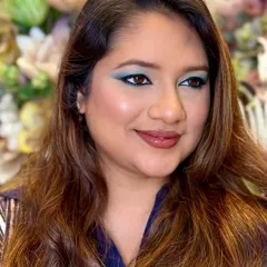 A side profile showing the beautiful blending of the teal shadow. Makeup is about character, and this look has plenty.