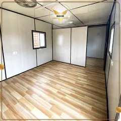 This is the interior of a brand new office container before furnishing. The clean, white insulated walls and wood-laminate flooring provide a bright and professional base that can be configured to your exact needs.
