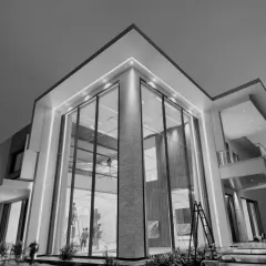 A glimpse of our upcoming residence, featuring seamless transitions from facade to interiors. The double-height glass facade creates a sense of transparency and grandeur, redefining modern living.