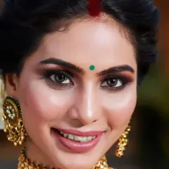 A close up of a stunning reception look. I created a dramatic smokey eye with sharp eyeliner for this bride, paired with a soft nude lipstick to keep the focus on her expressive eyes. This is a classic choice for an evening event.
