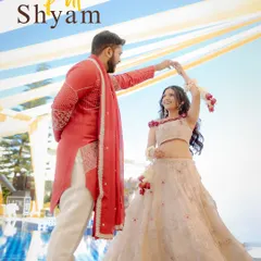A playful dance during the Haldi celebrations. The groom twirls his bride, both of them smiling, in a candid moment of fun.