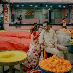 A candid moment shared between the couple at a flower stall in KR Market. Even in a busy public space, I focus on creating a private world for you, capturing the smiles and glances that are just for each other.
