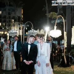A candid moment of laughter between the couple during their reception. Even in the midst of a big party, it’s these small, shared moments that are the most precious.