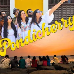 A perfect Pondicherry postcard. A group of travelers points towards a sight, full of curiosity and joy. My trips are about exploring the French-inspired architecture and soaking in the unique vibe of this town.
