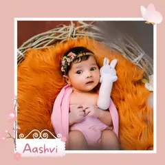 This alert baby girl, named Aashvi, holds her toy and looks on with curiosity. Capturing these awake moments provides a glimpse into your baby's developing world.