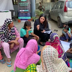 An intimate legal awareness session with women and children from an underprivileged community, in collaboration with the Shubham Tyagi Foundation. Sitting with them on the ground helps break down barriers and fosters an environment of trust.