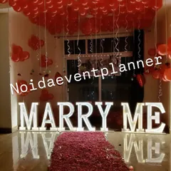 Our classic 'MARRY ME' light-up letters paired with a ceiling full of red balloons and a rose petal floor is a guaranteed way to get a 'yes'.