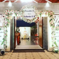 A straight-on view of the floral entrance arch, showcasing its fullness and the elegant welcome sign. This type of entrance makes a statement and is perfect for formal wedding celebrations.