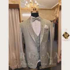 A unique take on a groom's reception suit in a beautiful sage green. I designed this with a peacock-inspired motif, using tonal and silver beadwork to create the texture of feathers on the lapel and cuff.
