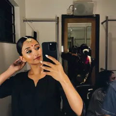 A quick backstage selfie while getting ready for a performance. A moment of calm before the energy of the show begins.