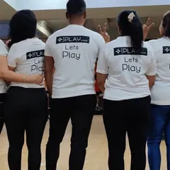 Our team shirts say it all: "Lets Play". This photo from behind shows our members united as a team, ready to take on any fitness challenge together.