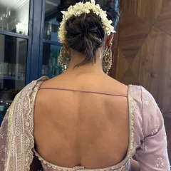 A view from the back of the classic gajra bun, showing the neatness of the work and how beautifully it complements a traditional saree or lehenga.