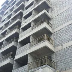 A close-up on the balconies during construction. Even at this early stage, the clean lines and repeating patterns of the architectural design are visible.