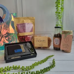 A complete corporate gift set featuring a branded wallet, keychain, and pen, paired with our gourmet snacks like Beetroot Chips and Palmiers. It's a sophisticated way to show appreciation.