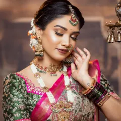 A closer look at this beautiful embroidered green blouse. The thread work is so intricate, and the pearl tassels on the sleeves are a detail I absolutely adore.