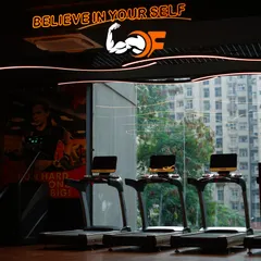 "Believe in yourself." This motivational message hangs above our cardio section, which features a row of treadmills overlooking the city through large windows.