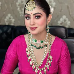 This unfiltered photo showcases a traditional look with a focus on the eyes. We practice creating sharp, defined eye makeup that complements heavy traditional jewelry.
