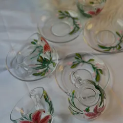 A full set of our hand-painted lily and floral teacups and saucers. You can choose your favorite style, with or without the saucer, to match your personal taste.