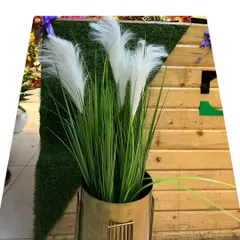 We offer trendy options like this artificial pampas grass in a sleek planter. It's perfect for adding a soft, bohemian touch to a room without worrying about the fragility and shedding of dried natural pampas.