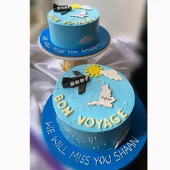 Two "Bon Voyage" cakes for two friends embarking on a new journey together. It was special to create a matching set for their farewell.